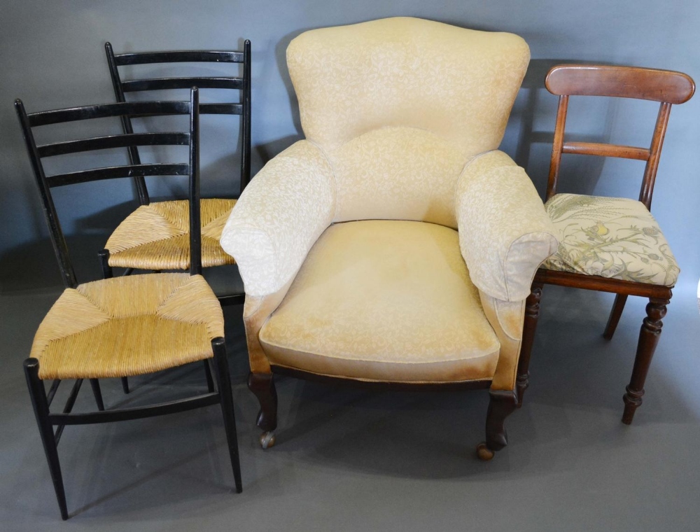 An Edwardian Upholstered Armchair, together with a pair of rail backed side chairs and a Victorian