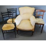 An Edwardian Upholstered Armchair, together with a pair of rail backed side chairs and a Victorian