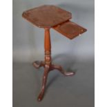 An Early 19th Century Mahogany Teapot Stand, the octagonal top above a turned centre column raised