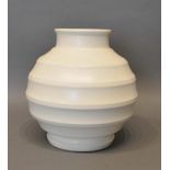 A Wedgwood Vase by Keith Murray of stylised form, matt straw ground, 19cm tall