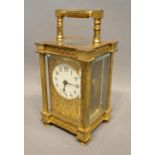 A 19th Century French Brass Cased Carriage Clock, the enamelled dial with Arabic numerals with lever