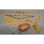 An Amber Bead Necklace, together with three similar necklaces and a similar bracelet