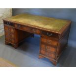 A Mahogany Twin Pedestal Desk, the tooled leather inset top above nine drawers with brass handles