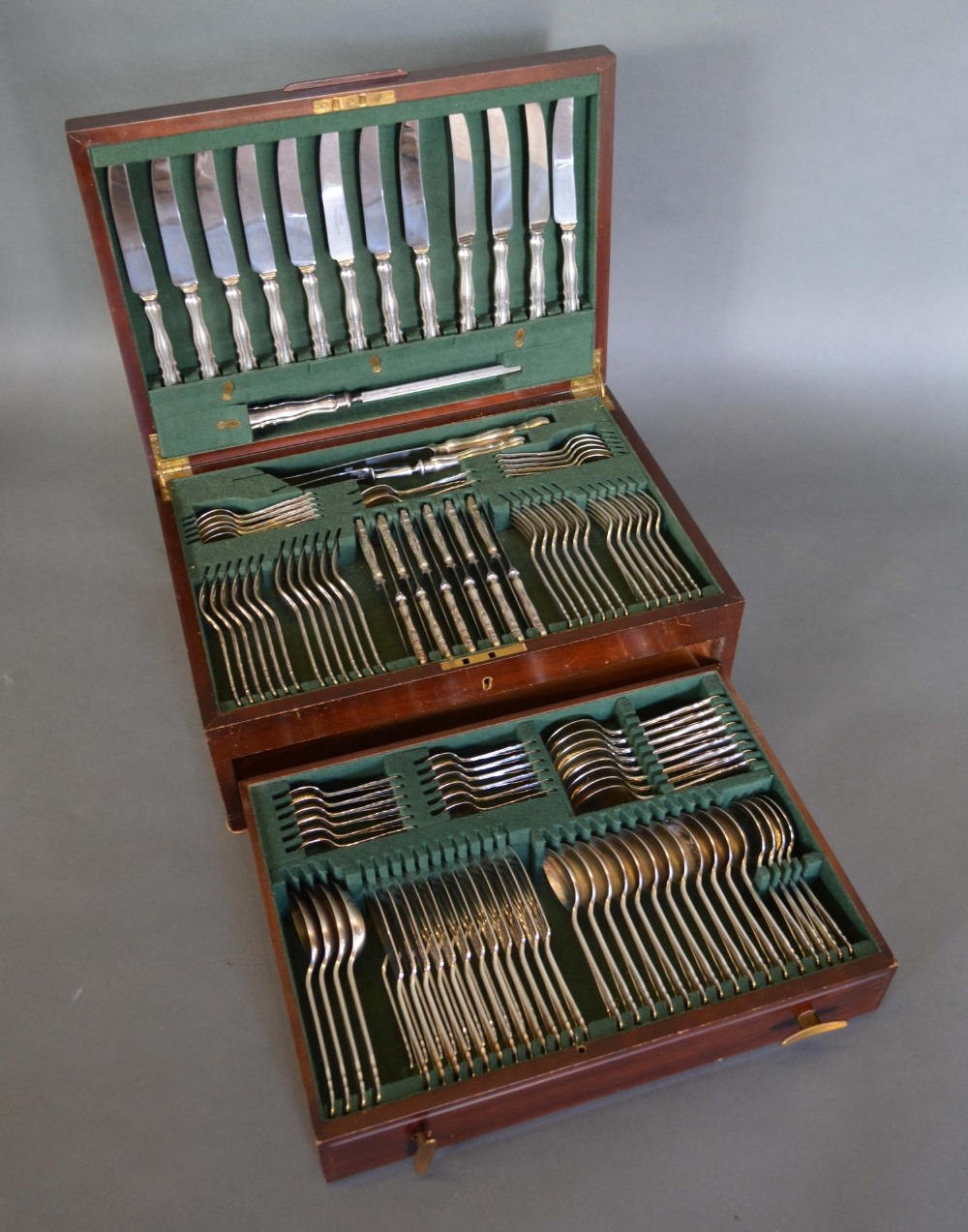 A Silver Plated Canteen of Cutlery by Dixon within fitted mahogany case