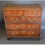 A George III Oak Two Part Chest, the moulded top above two short and three long drawers with brass
