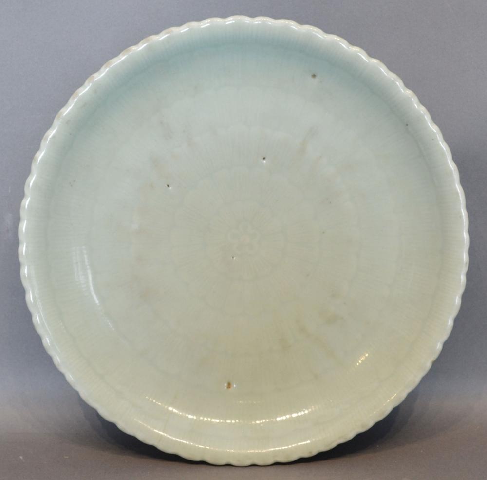 A Chinese Celadon Glazed Moulded Flower Form Dish, Qianlong six character seal mark in underglaze