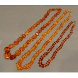 An Amber Bead Necklace, together with two other Amber Necklaces