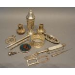 A Small Collection of Silver to include a mother of pearl handled pickle fork, a pair of peppers,