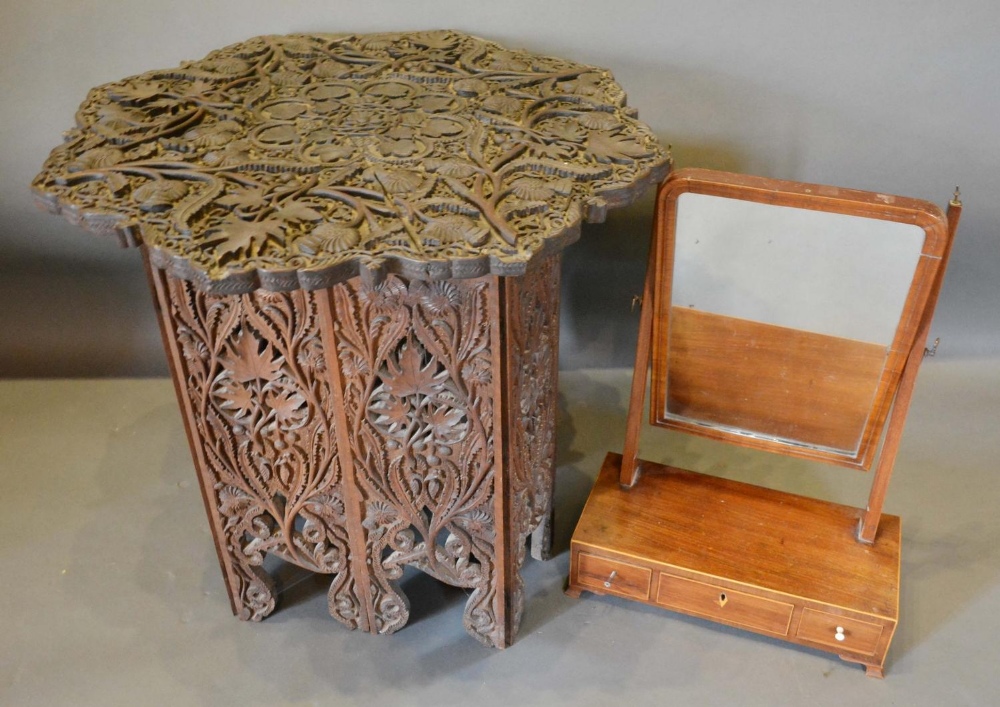 A Carved Hardwood Occasional Table, together with a 19th century mahogany swing framed toilet mirror