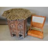 A Carved Hardwood Occasional Table, together with a 19th century mahogany swing framed toilet mirror