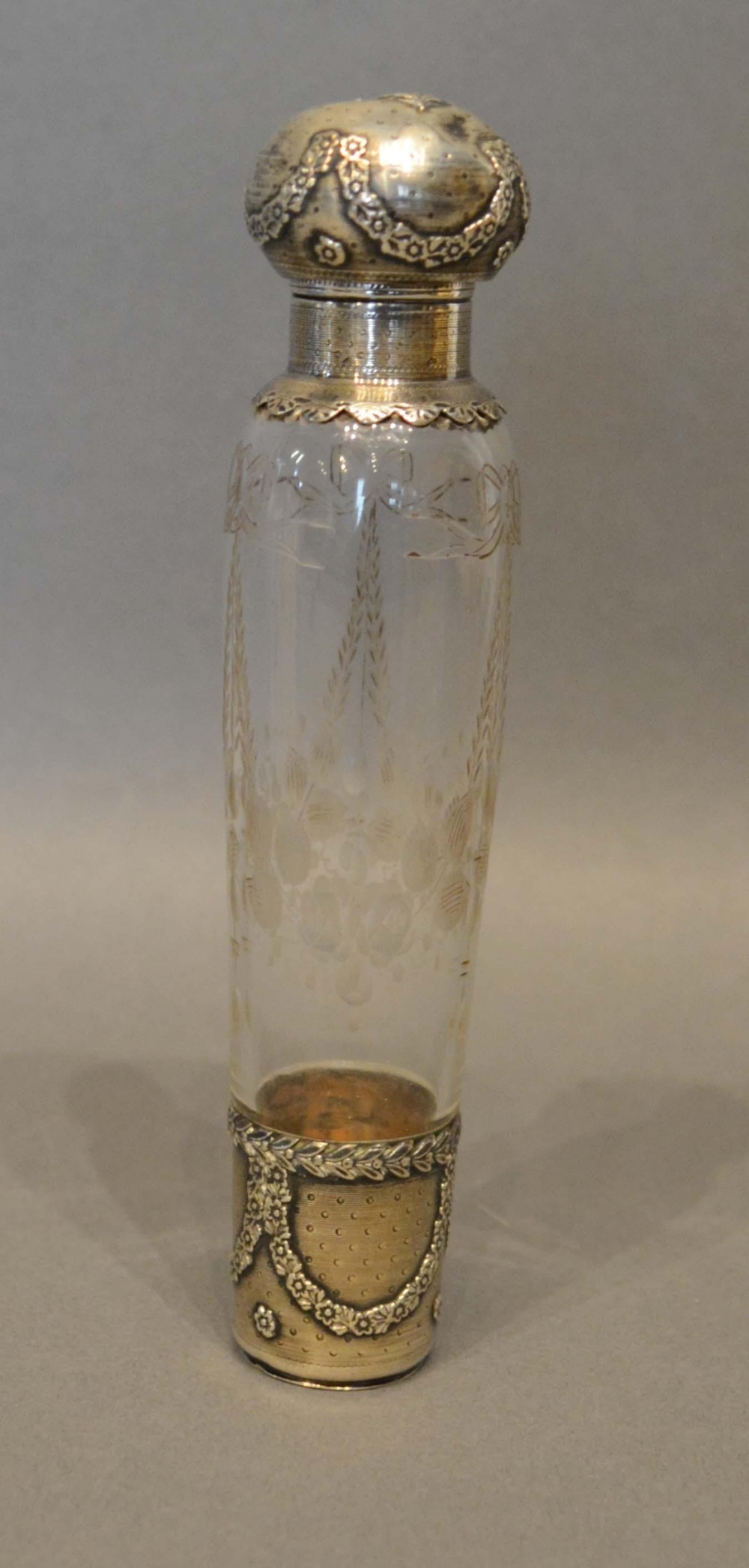 A French White Metal Mounted Scent Bottle engraved bows and swags, 14.5cm long