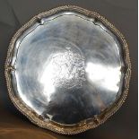 A Victorian Silver Large Salver by Richard Garrard of shaped outline with four scroll feet and