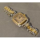 An 18 Carat Yellow Gold Ladies Wristwatch of Square Form with associated stainless steel strap