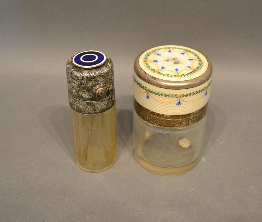 A French White Metal and Enamel Decorated Scent Bottle, together with another similar and an