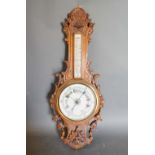 A Victorian Carved Oak Barometer Thermometer