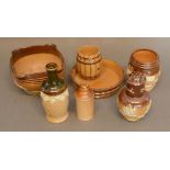 A Doulton Lambeth Stoneware Mat Holder on Tray in the form of barrels, together with another similar