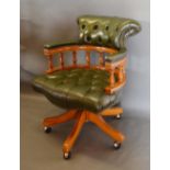 A Button Leather Upholstered and Spindle Back Revolving Office Armchair