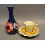 A Moorcroft Tube Lined Vase, 15.5cm tall, together with a Linthorpe cup and saucer
