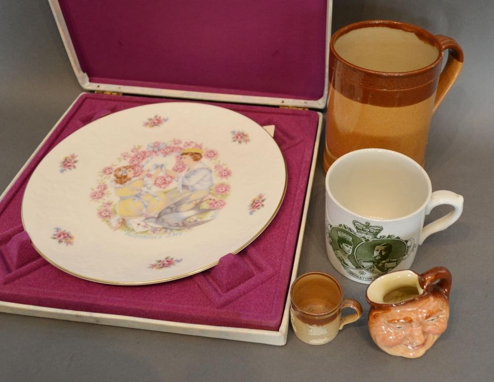 A Doulton Lambeth Stoneware Jug, together with another similar smaller, a Royal Doulton ashtray, a