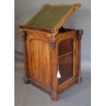 A William IV Rosewood Clerk's Desk, the shaped hinged top with tooled leather writing surface