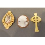 An Oval Cameo Relief Decorated with the Head of a Lady, together with an ivory brooch and a
