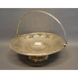 A Victorian Sheffield Silver Fruit Basket with pierced and engraved decoration upon a shaped