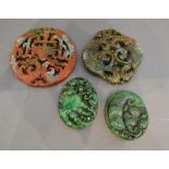 A Chinese Stone Pendant of Pierced Form, together with another similar and two similar jade pendants