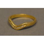 An 18 Carat Yellow Gold Diamond Set Wishbone Ring
