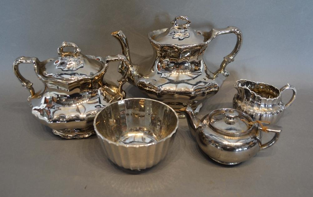 A Lustre Teapot With Matching Sucrier and three other similar items of lustre