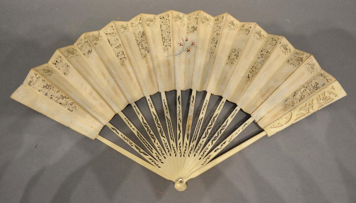 A Mid 18th Century English Fan, the pierced leaf with foliate painting, with carved sticks and - Image 2 of 2