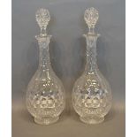 A Pair of Good Quality Cut Glass Decanters of shaped bulbous form, 33cm tall