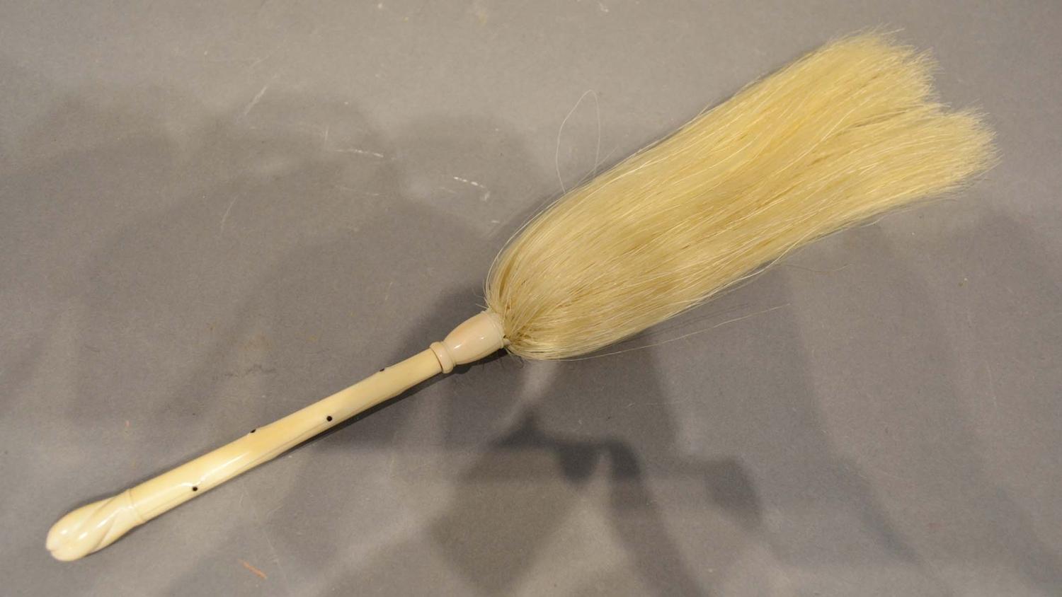 A Carved Ivory Fly Whisk, the handle 14.5cm long
