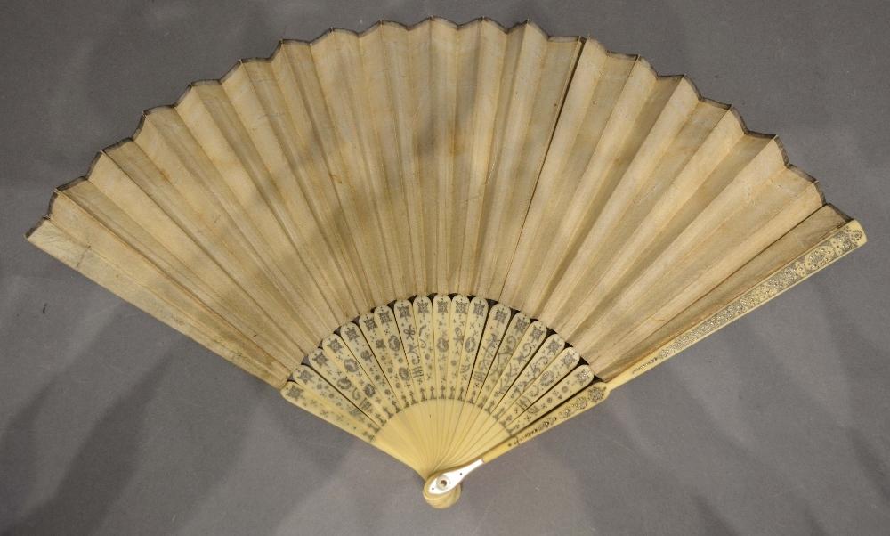 An Early 18th Century Paper Leaf Fan painted with bows and swags and mounted with sequins, the ivory - Image 2 of 2