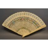 A 19th Century Carved Ivory Brise Fan of finely pierced form, hand painted with summer flowers to