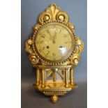 A Carved Giltwood Cartel Wall Clock, 49cm long