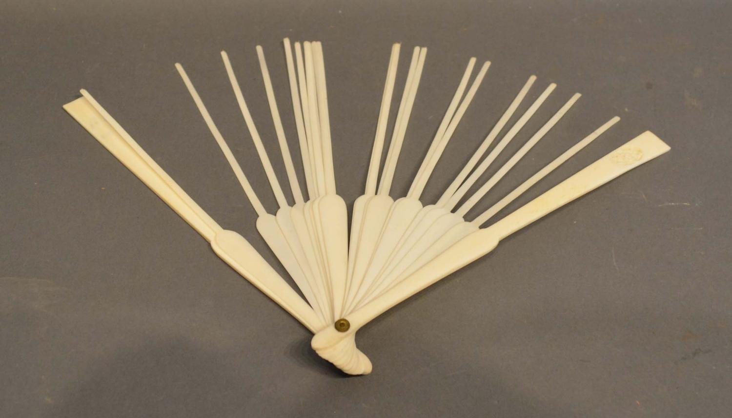 A Set of late 19th/Early 20th Century Carved Ivory Sticks and Guards for a Fan, the guards each