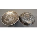 A Pair of Chinese White Metal Bowls decorated in relief with serpents amongst foliage, seal marks to