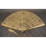 A 19th Century Ivory Fan by Nathalie of Sloane Street, London, the cream gauze leaf with sections of