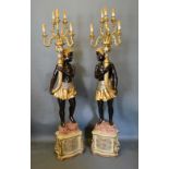 A Pair of Blackamoor Floor Standing Candelabrum, each of figural form with six scroll branches,