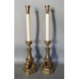 A Pair of 18th Century Style Table Lamps in the form of candle stands, each with four scroll feet