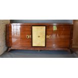 An Art Deco Large Bow Fronted Side Cabinet, the stepped top above central panel door enclosing