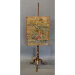 A 19th Century Mahogany Pole Screen with Berlin tapestry panel with a turned centre column and