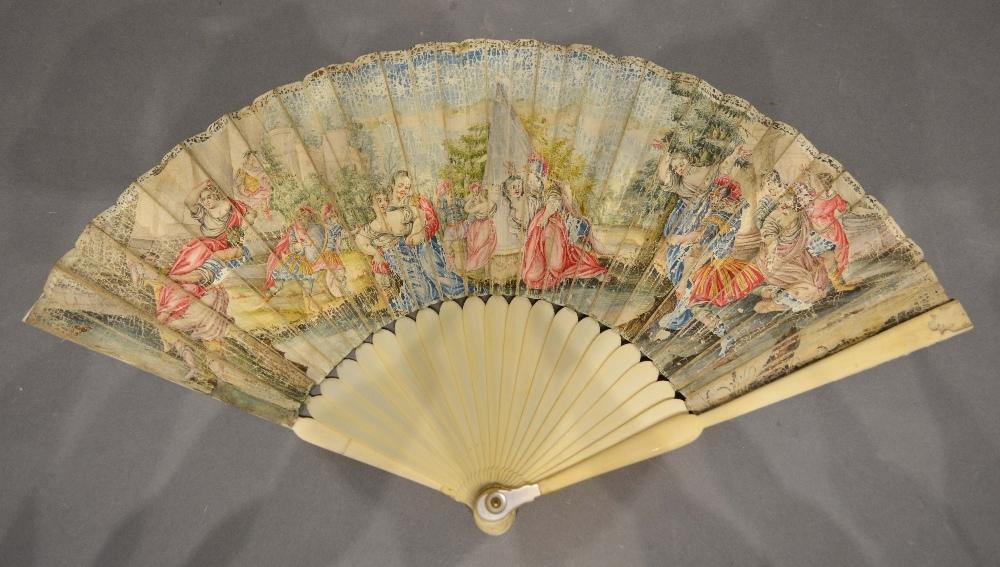 An 18th Century Ivory and Vellum Leafed Fan with ivory sticks and ivory and mother of pearl