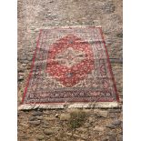 A North west Persian Woollen Rug, with all over design upon a red and cream ground, 200cm by 141cm