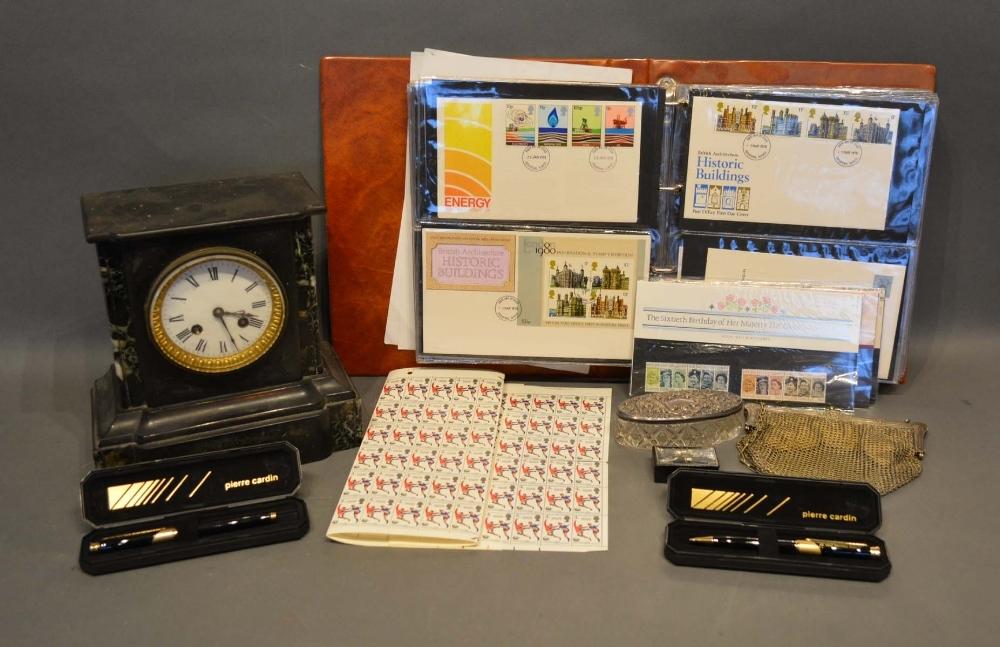 An Album of First Day Covers, a black slate mantel clock and other items