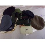 British Military Mixed lot including: (4) Peaked caps and Berets, (5) belts with three stable,