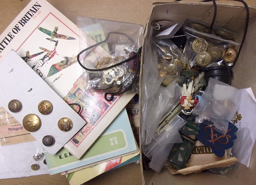 A mixed Military lot of buttons, badges, misc medallions, cloth patches, Books on WWII etc. A good