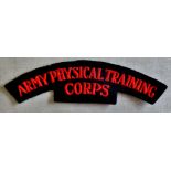British WWII Army Physical Training Corps cloth shoulder title, red on black