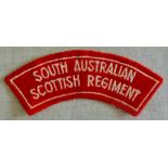 Australian South Australian Scottish Regiment cloth shoulder title, white on red