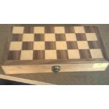 Wooden inlaid chess box containing full set of wooden chess pieces. Condition - Good